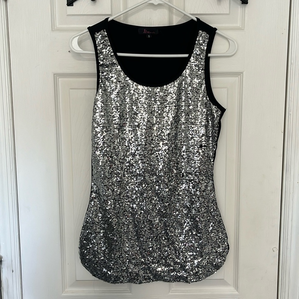Women’s size small sleeveless sequin shirt.